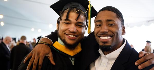 A proud graduate with his father.