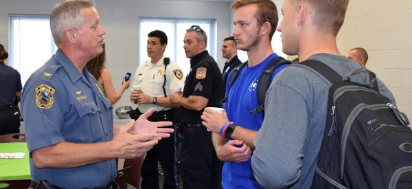 Police officers talking with students about careers