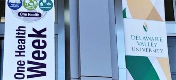 A banner that reads One Health Week hangs on the outside of Delaware Valley University's Life Sciences Building.