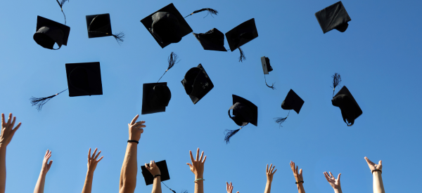 Students Throwing Caps in the air 