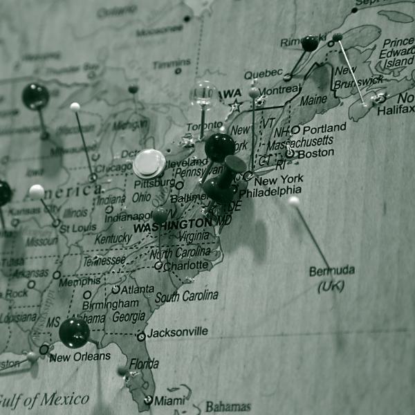 A pale green map of the eastern United States centered on the Northeastern corridor embedded with pins