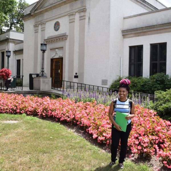 Student in front of library