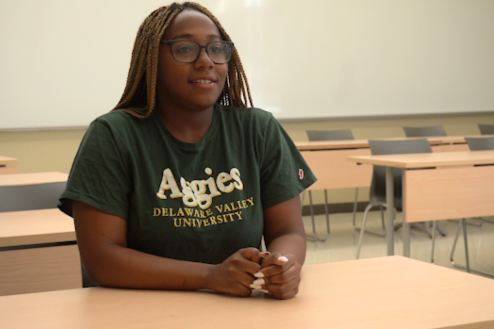 Khemit Umoren, an african american student discussing the program while sitting in a DelVal classroom