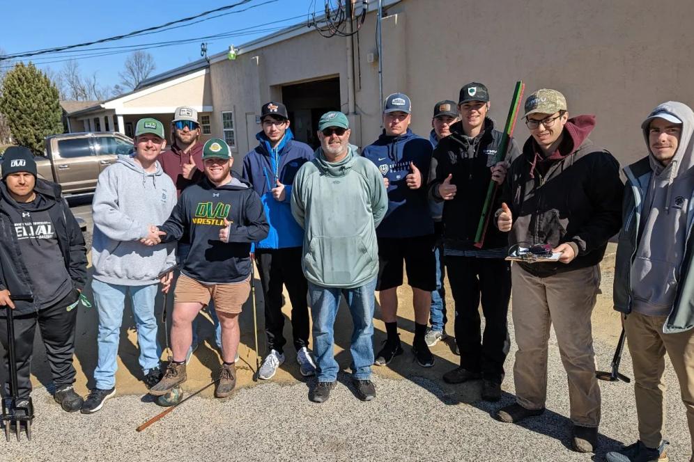 A photo of a group of current students and alumni from the turf program. 