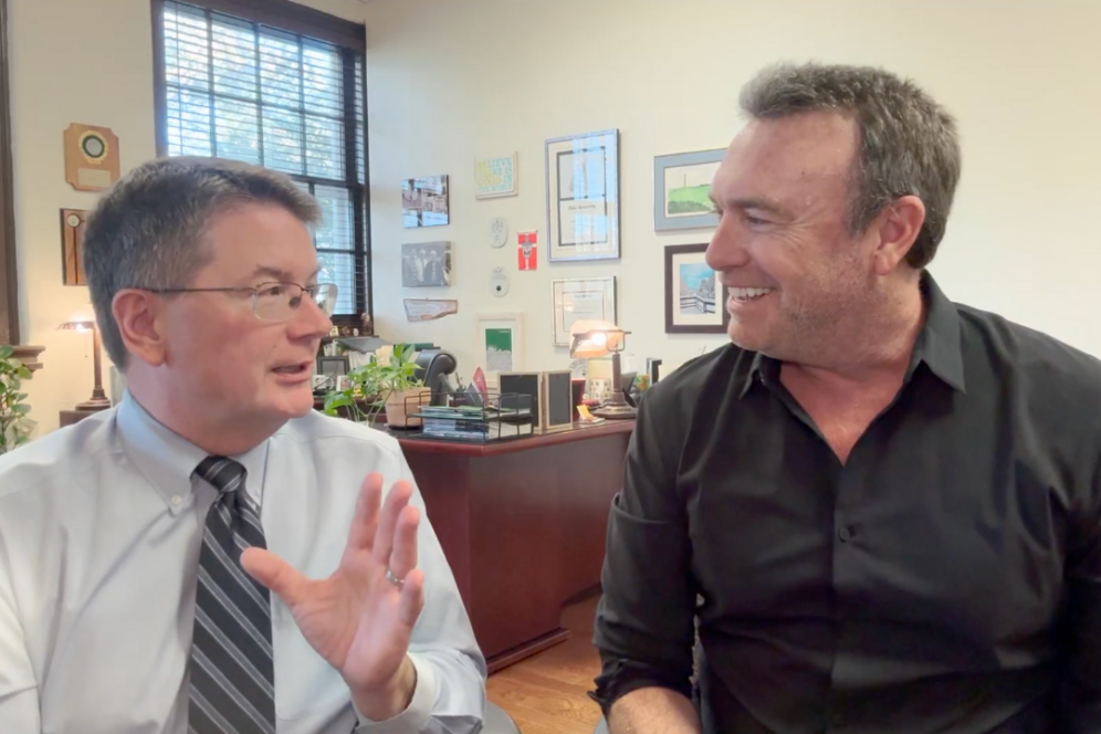 Dr. Benjamin Rusiloski, president of DelVal, is speaking with Alex Boylan in Dr. Ben's office.